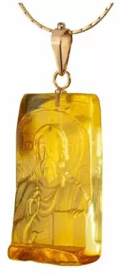 Золотой кулон с объемной резьбой по натуральноиму цельному янтарю "Иисус Христос"